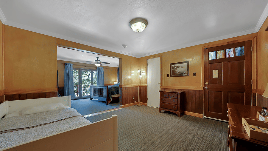 Living area of a room at Narrow Gauge Inn with a cabinet.