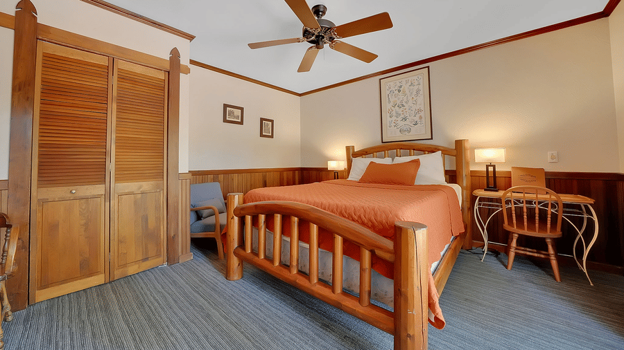 A view of a room at Narrow Gauge Inn with a double bed.