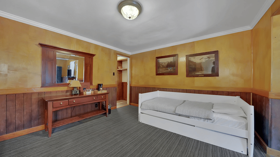 Living room area of a room at Narrow Gauge Inn with a couch.