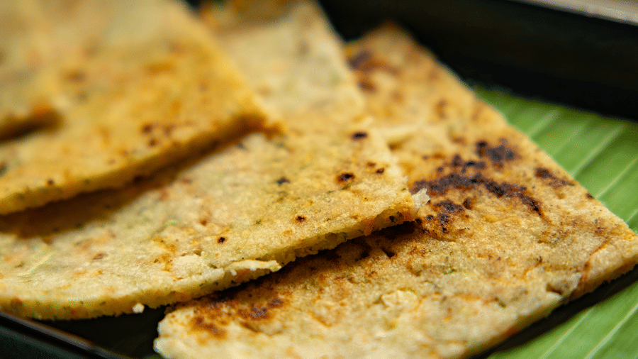 A close-up of folded pieces of flatbread on a banana leaf at Stanley Revelation.