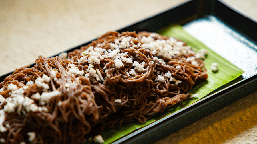 A close-up of folded pieces of flatbread on a banana leaf at Stanley Revelation.