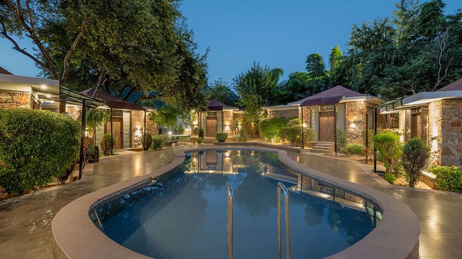 A swimming pool surrounded by accommodations at Valley by Grassfield.