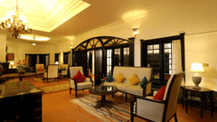 rustic room with chairs and sofa