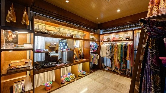corner view image of the souvenir shop with a lot of clothes hanging - Maikhao Dream Villa Resort & Spa, Phuket