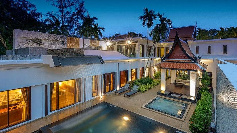 image taken from a higher level on a late evening of the facade of the villas at maikhao dream villa resort and spa, phuket