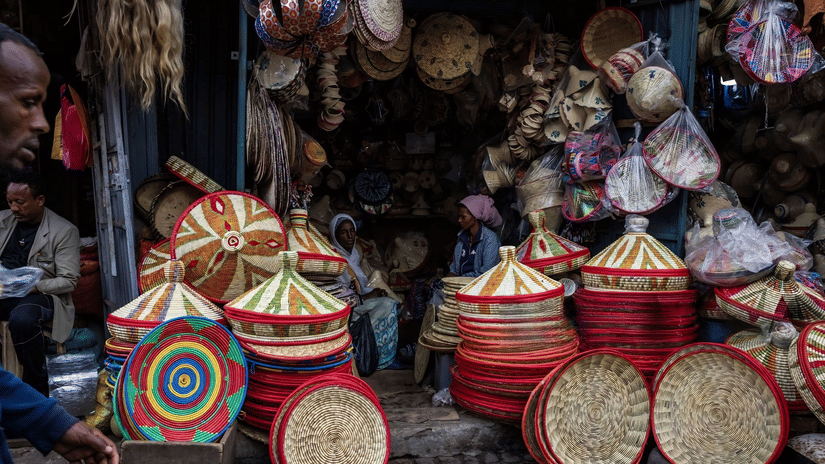 Colourful handwoven baskets and traditional crafts on display at a local market.