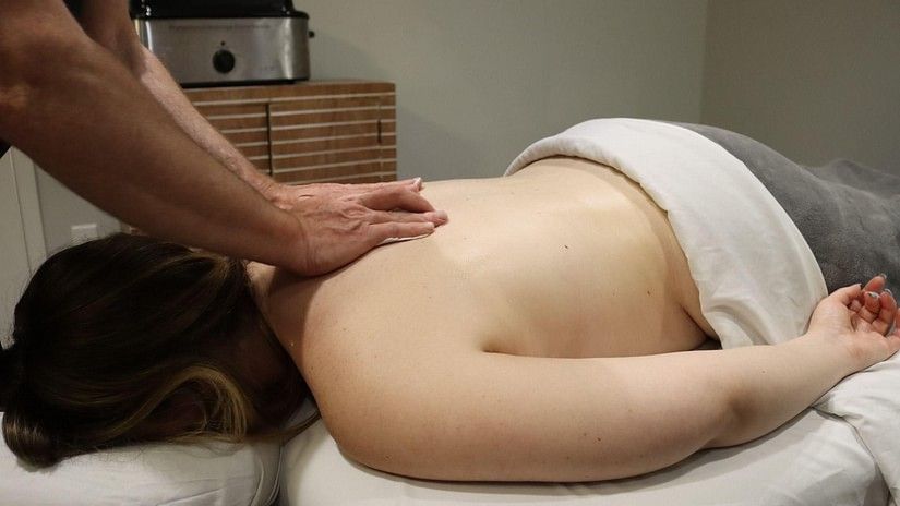 The back of a woman receiving deep tissue massage at YO1  health resorts