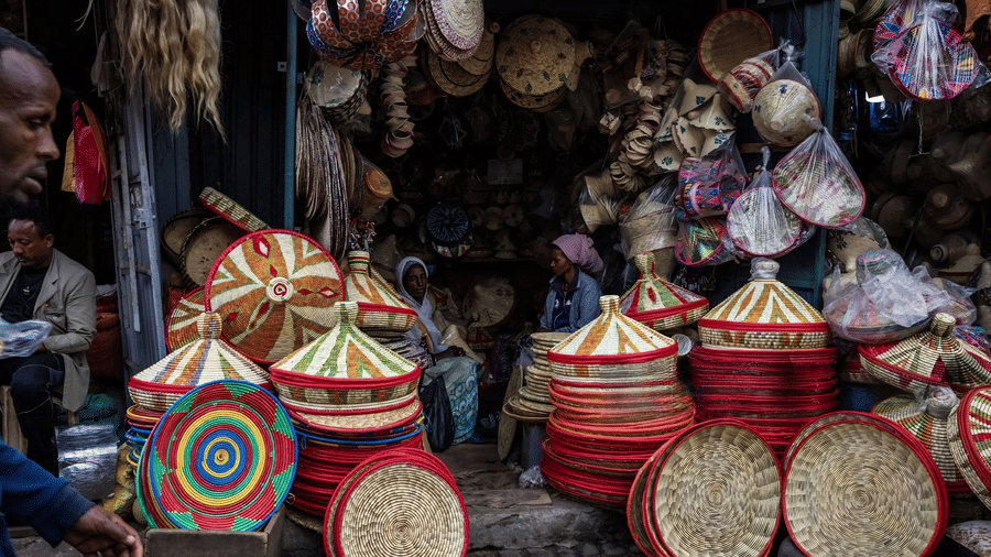 Colourful handwoven baskets and traditional crafts on display at a local market.