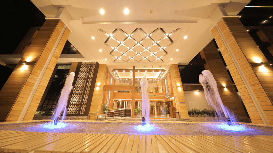 A facade with grand chandeliers at Sarovar Portico, Somnath