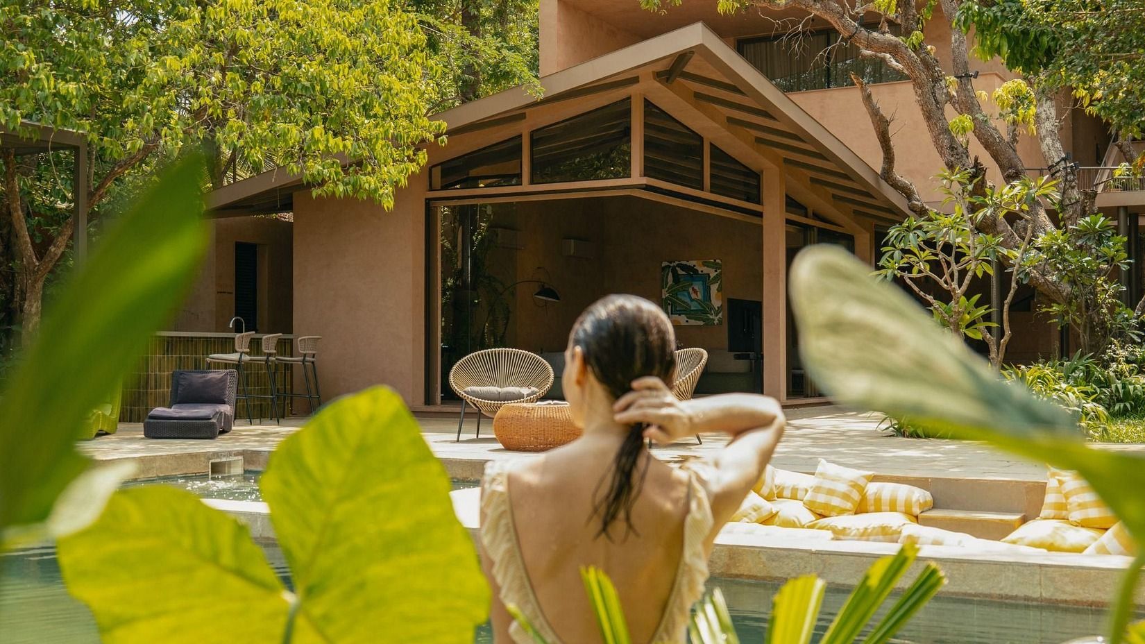 Outdoor spa experience surrounded by lush greenery at a luxury villa