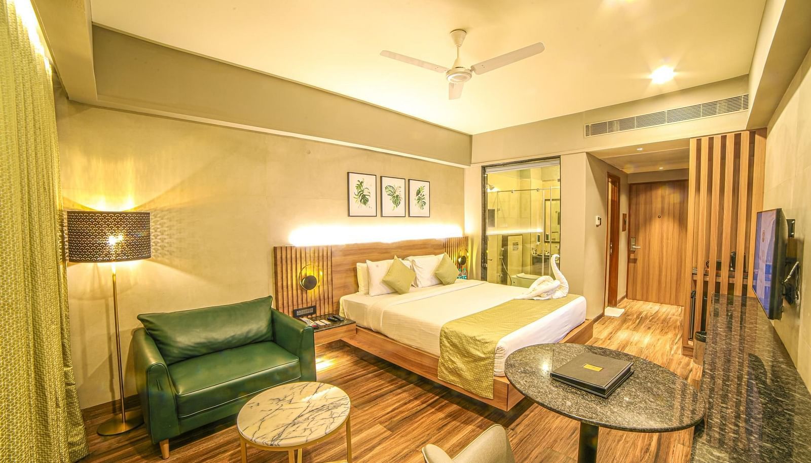Wide view of the seating and the double bed in Sunrise Room at Grand Palace, Yercaud