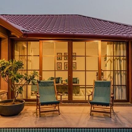 Evening view of the Private Plunge Pool Villa at Surpura Bagh with a poolside sit-out and warm ambient lighting.