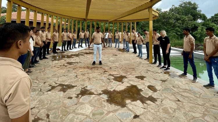 Group of people getting trained near a pool