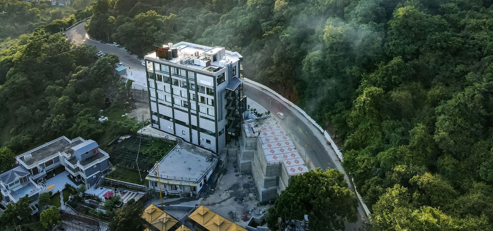 An aerial shot of a misty morning at NAMAMI BY ZENQ BANKHANDI