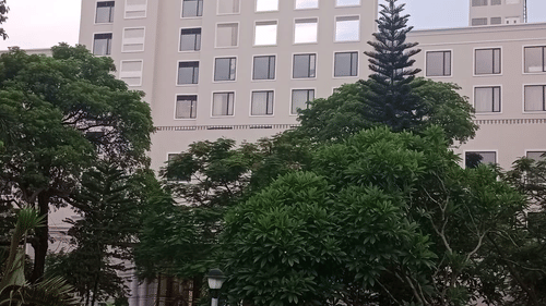 Exterior Facade of the hotel with trees in view - Hotel Polo Towers, Agartala