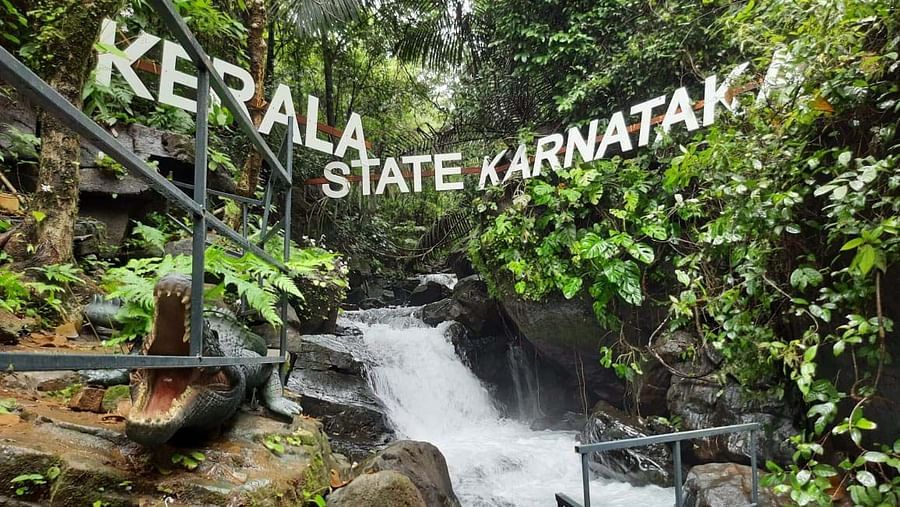 a waterfall next to rocks near Holistic Stay Eco Resort, Kannur