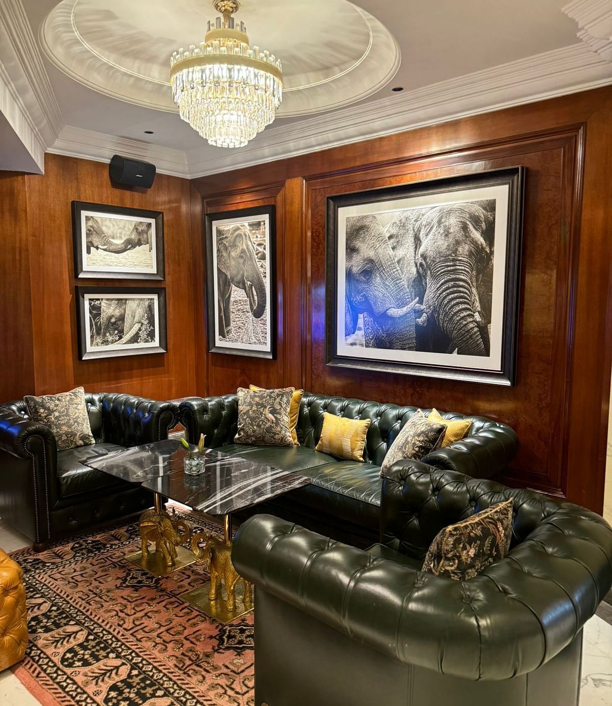 image of the elephant bar with elegant interiors and black leather couches -The Claridges New Delhi