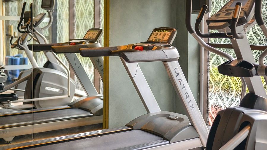 a close up image of a treadmill with a mirror beside it - Maikhao Dream Villa Resort & Spa, Phuket