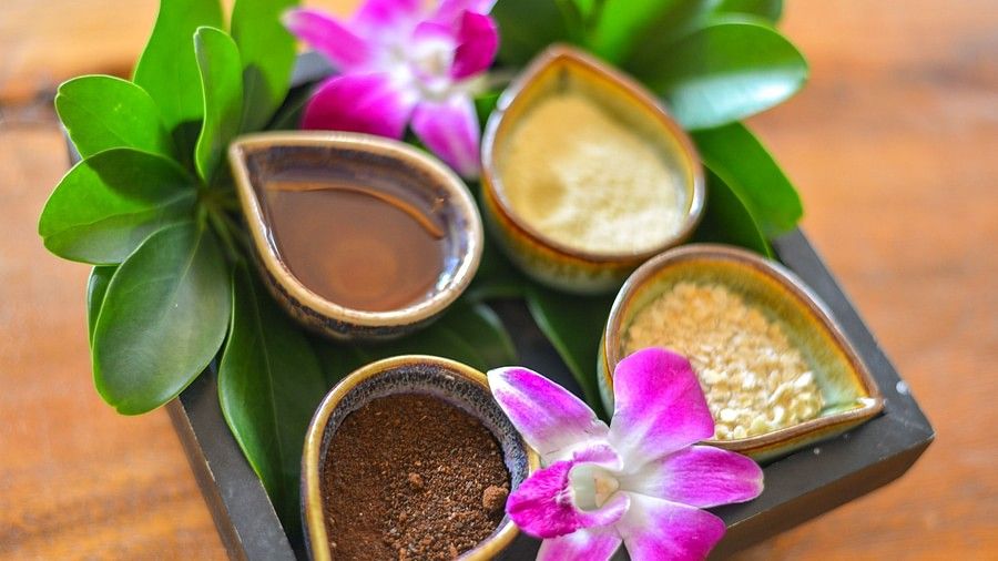 image of a dish with four bowls holding various elements for the spa - Maikhao Dream Villa Resort & Spa, Phuket