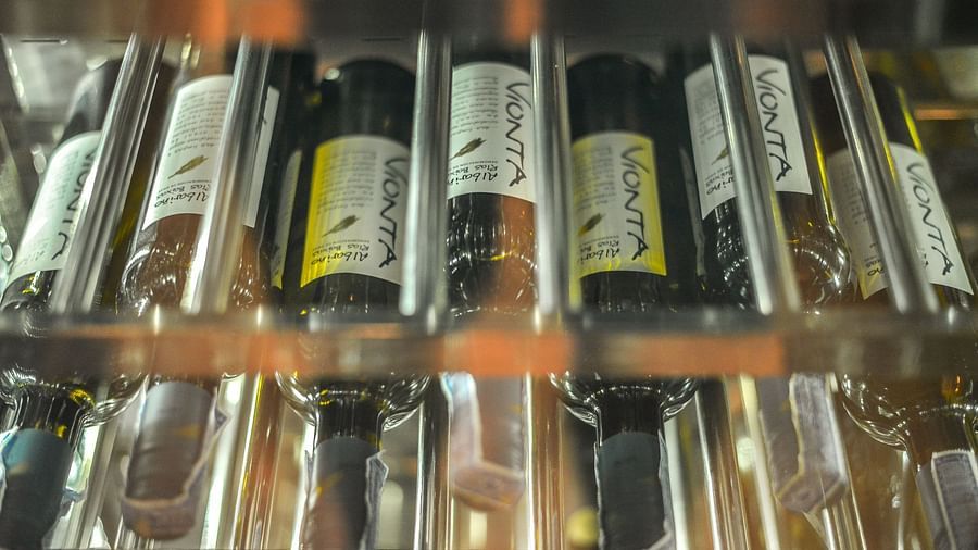 Several wine bottles stacked side-by-side at the wine cellar - Maikhao Dream Villa Resort & Spa, Phuket