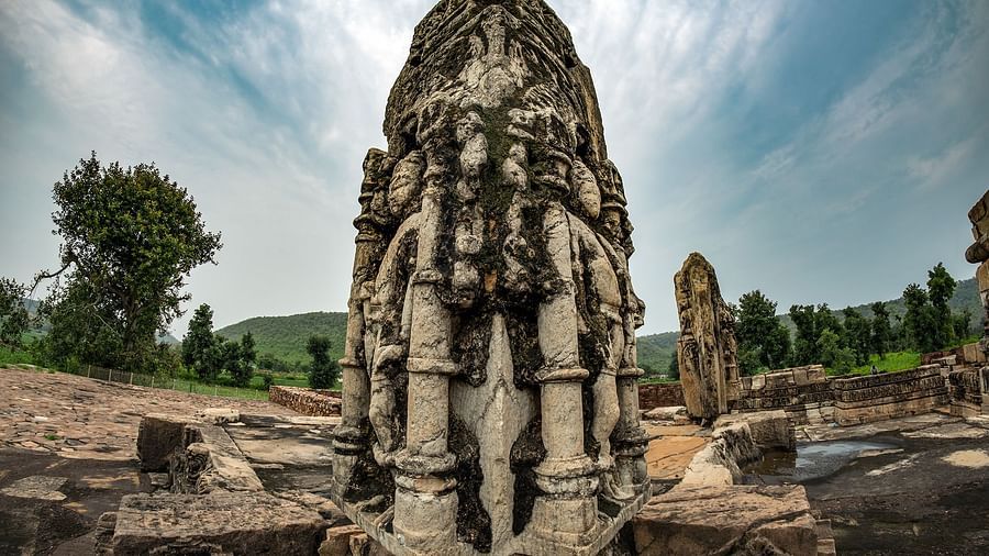 A large statue with intricate carvings at Neelkanth temple