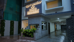 A facade view of the hotel during a evening with signboard - Grand Continent, Malleshwaram