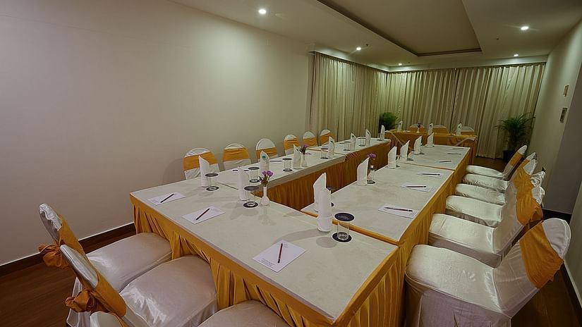 A U-shape seating at our meeting hall with comfy chairs - Grand Continent, Malleshwaram
