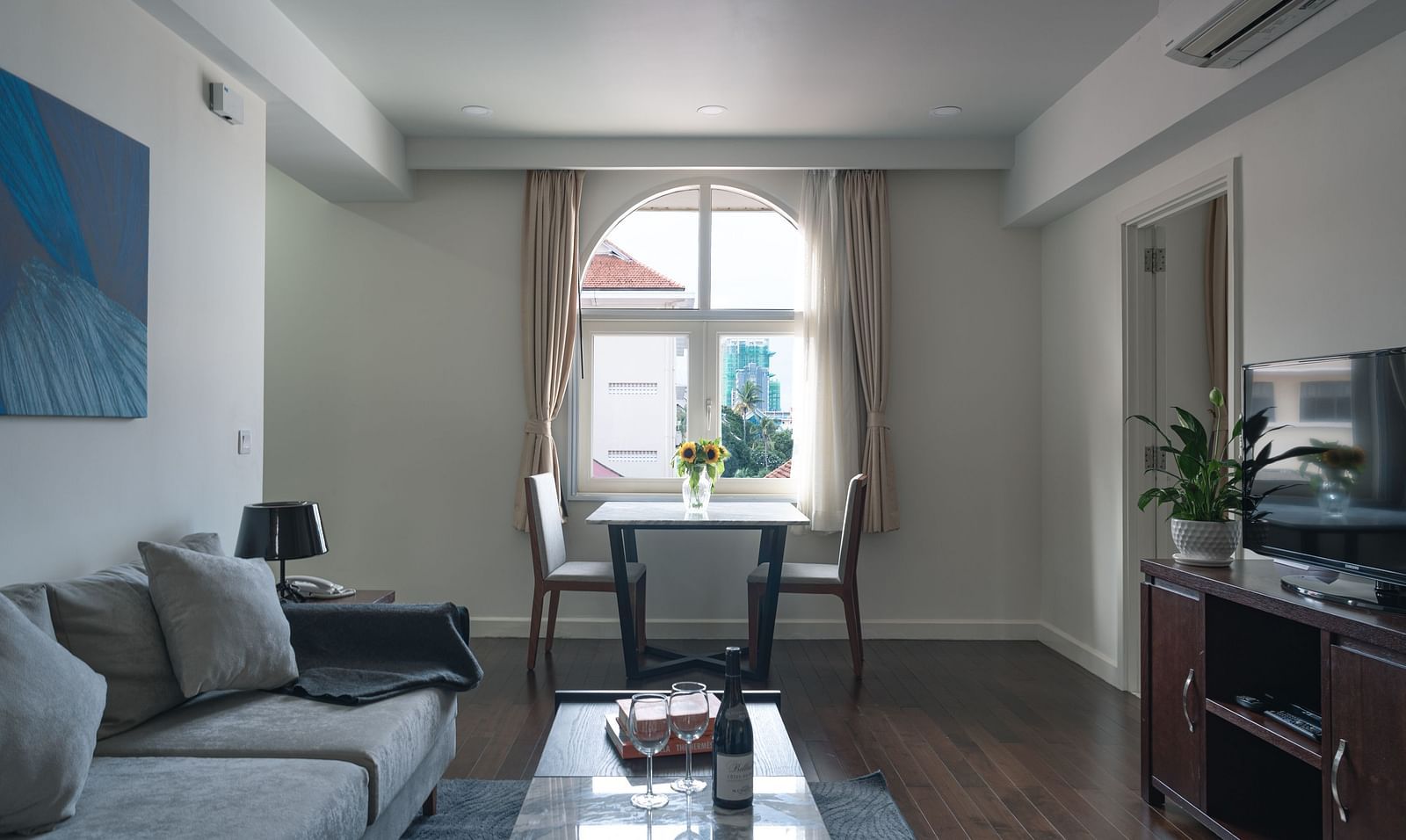 A living room, highlighting the window and the seating area | One-bedroom Suite | Central Mansions, Phnom Penh