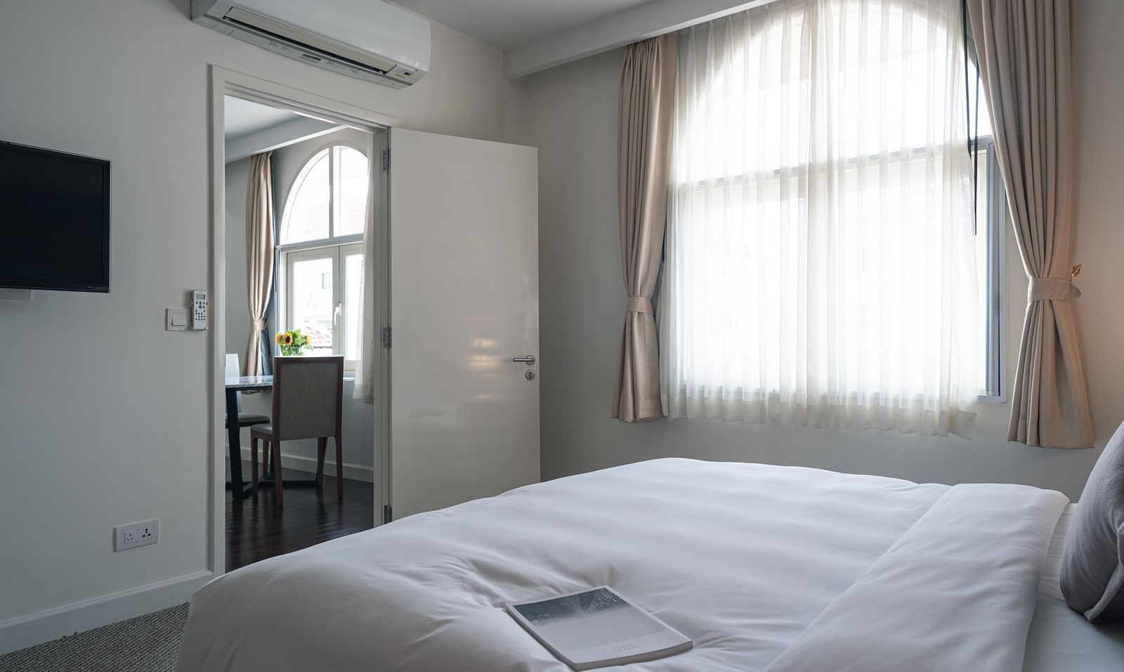 A view from the bed next to a large window of the other room | One-bedroom Suite | Central Mansions, Phnom Penh