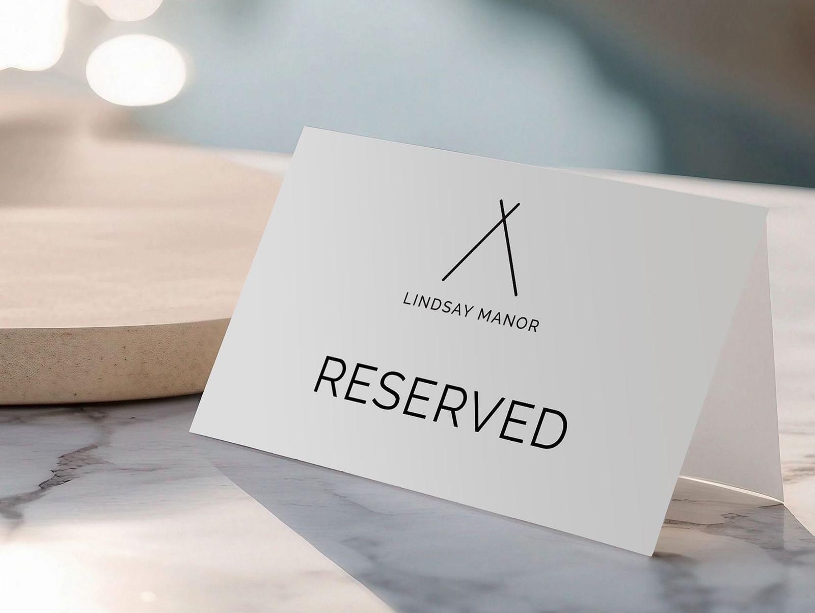An image of a paper on the table which says that the table is reserved - Lindsay Manor, Vagator