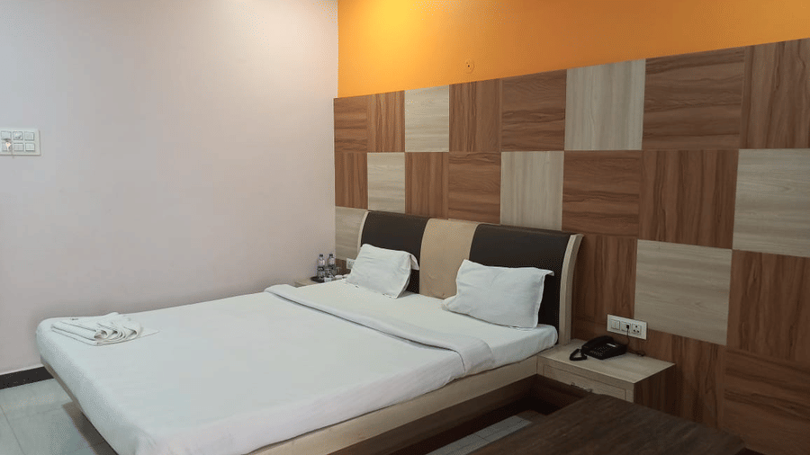 A wide angle shot of the deluxe room at Ram Bhawan Yamuna Prasad Hotels and Resorts.