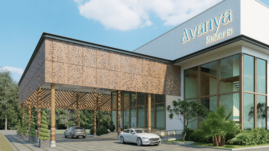 The facade of Avanya Resorts N Retreat with a car parked in the front yard.
