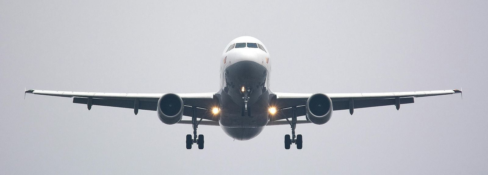 Image of an airplane soaring in the sky