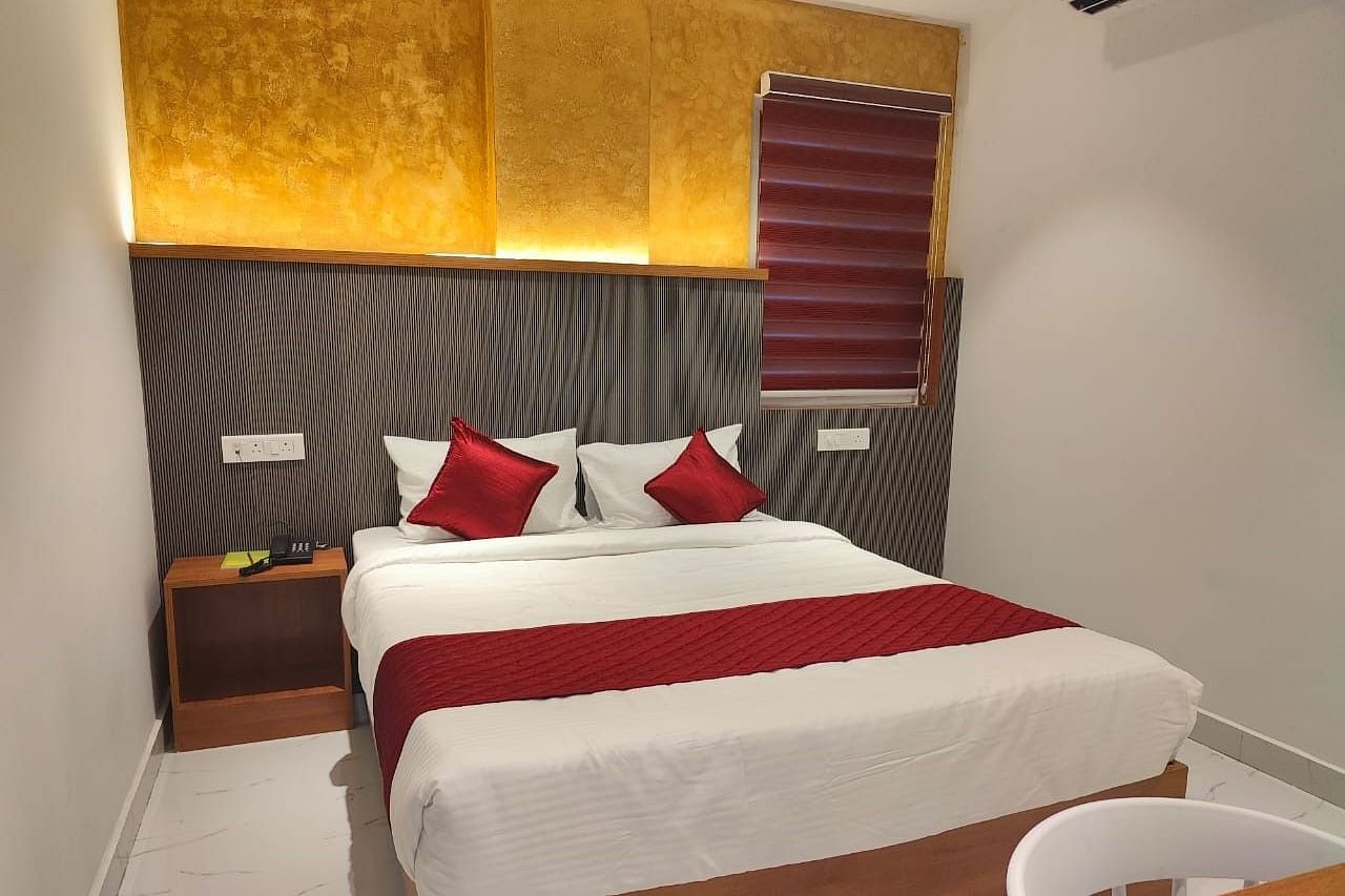 A view of the large bed at Hotel La Premier