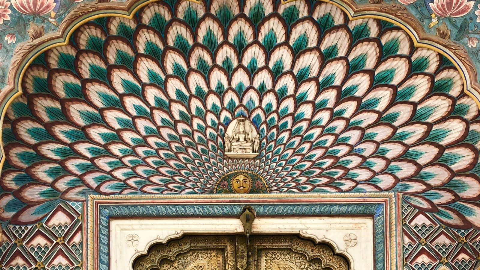 an overview of an entrance to a building in Jaipur, Rajasthan with colourful paintings