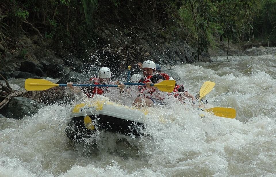 Picture featuirng a group of people rafting in rushing water