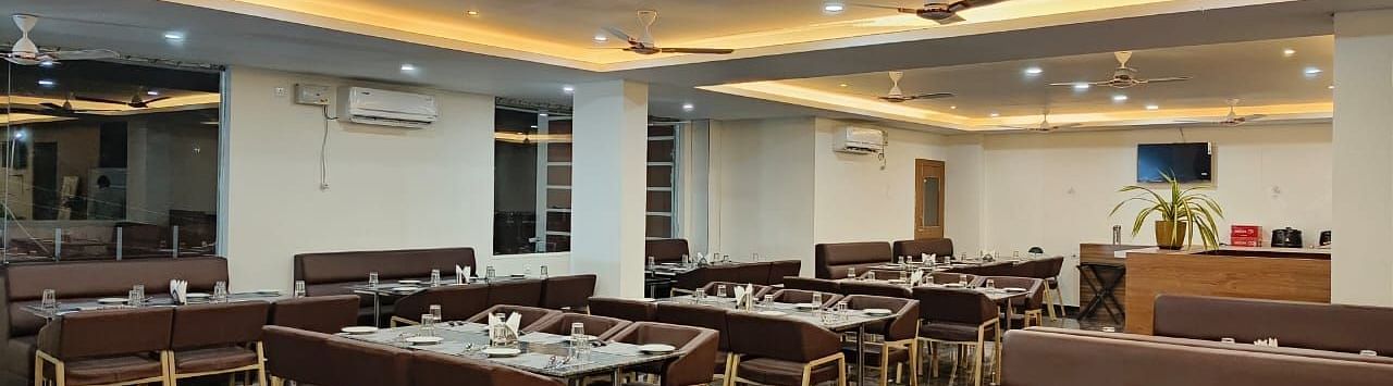 Dining arrangement in a restaurant at ANS M Square Hotel & Resort, Kalaburagi