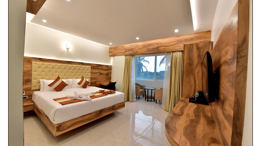 Royal Lotus View Resotel, Bangalore Bengaluru superior room with queen size bed and a closed balcony covered with curtain 2- Royal Lotus View Resotel