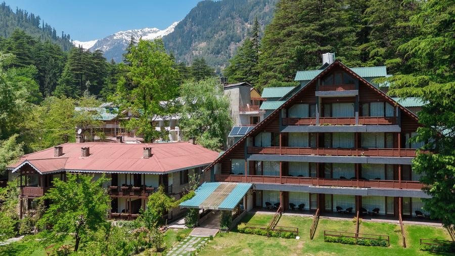 A facade image of Bedzzz Xclusiv Baikunth, Manali in an attic style during a bright sunny day