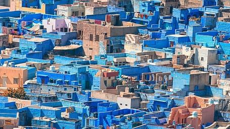 Aerial Shot of a city with Brown and Blue Houses