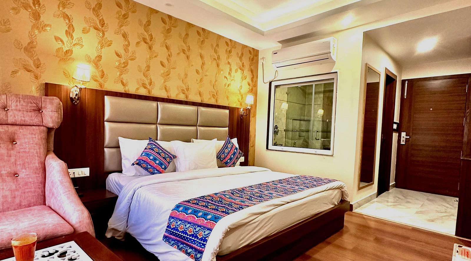 full view image of the superior room featuring a double bed and the entrance of the room - ZENQ SIGNATURE INN, MCLEODGANJ