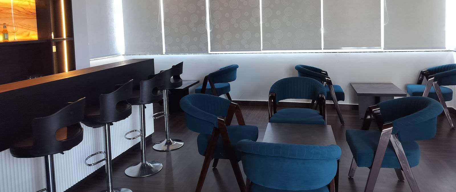 image of the forest ground cafe with blue coloured chairs - Eminence The Corbett