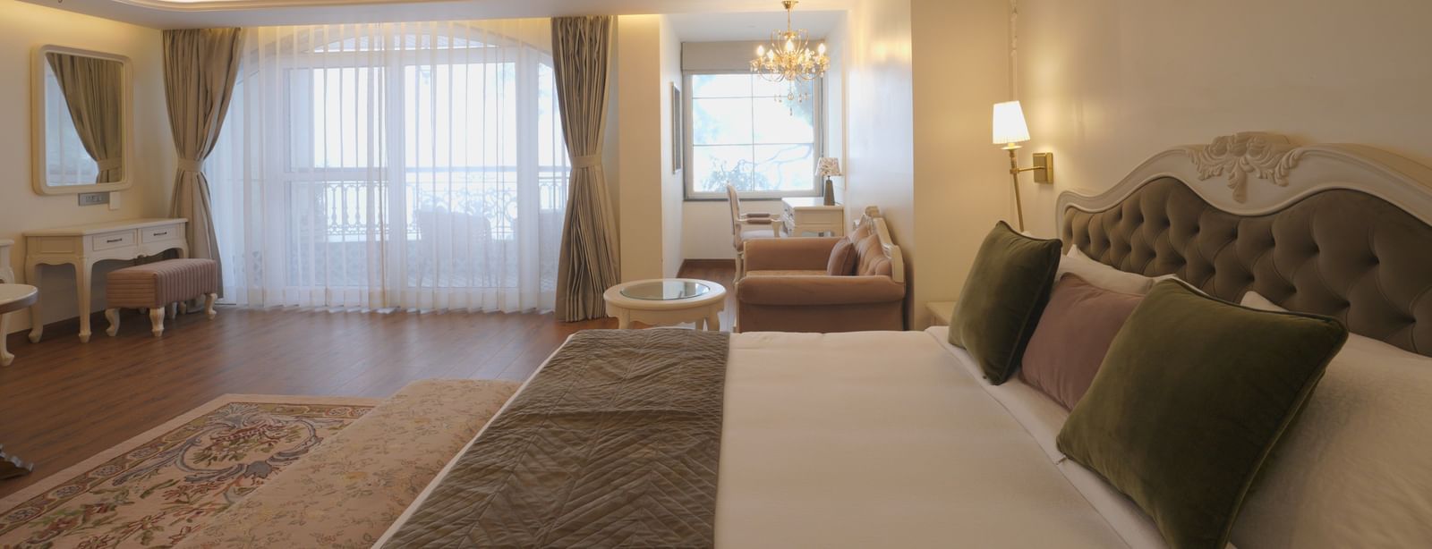 Premium bedroom featuring a plush bed, large windows, and subtle decor - Mayfair Cafe & Suites, Dalhousie
