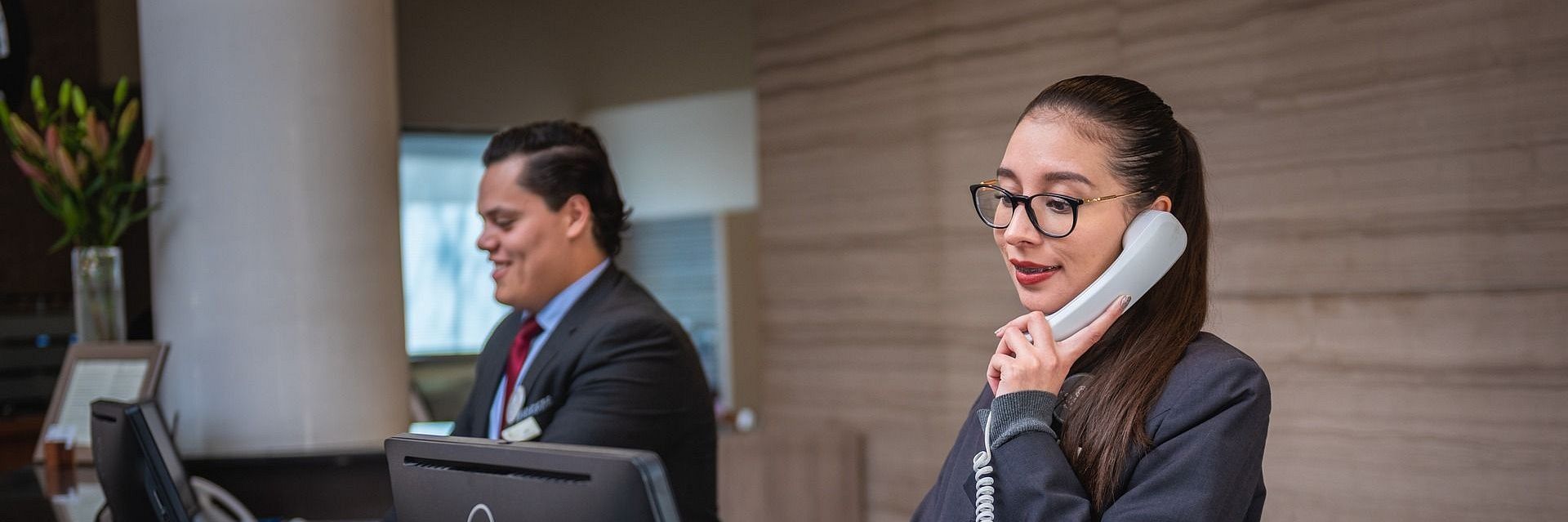 receptionists working at the front desk