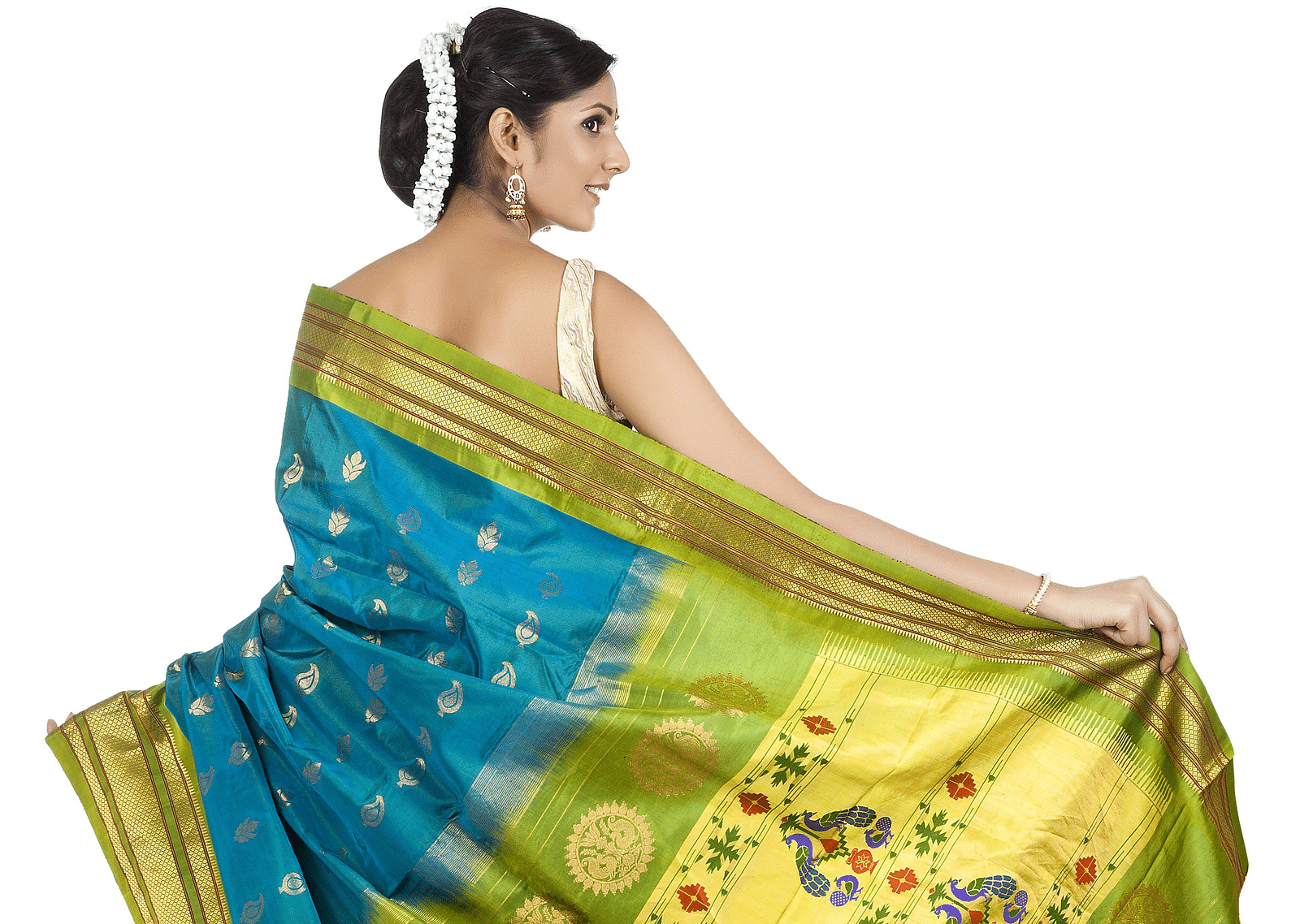 A woman posing for a picture while holding her Kanchipuram Silk Saree.