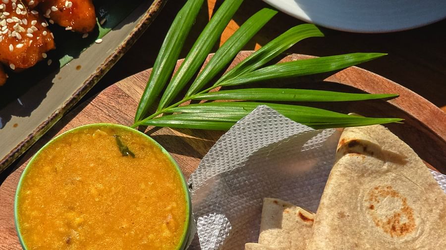Traditional Indian meal including roti, dal, and chutney with a side of tandoori starters at The Verda de Miranda Resort.