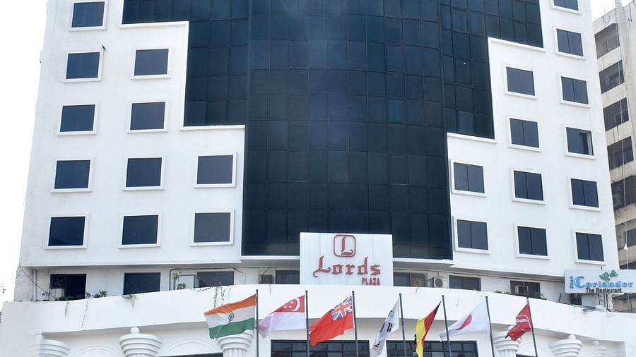 A multi-story building with signage marks the exterior of Lords Plaza Surat.