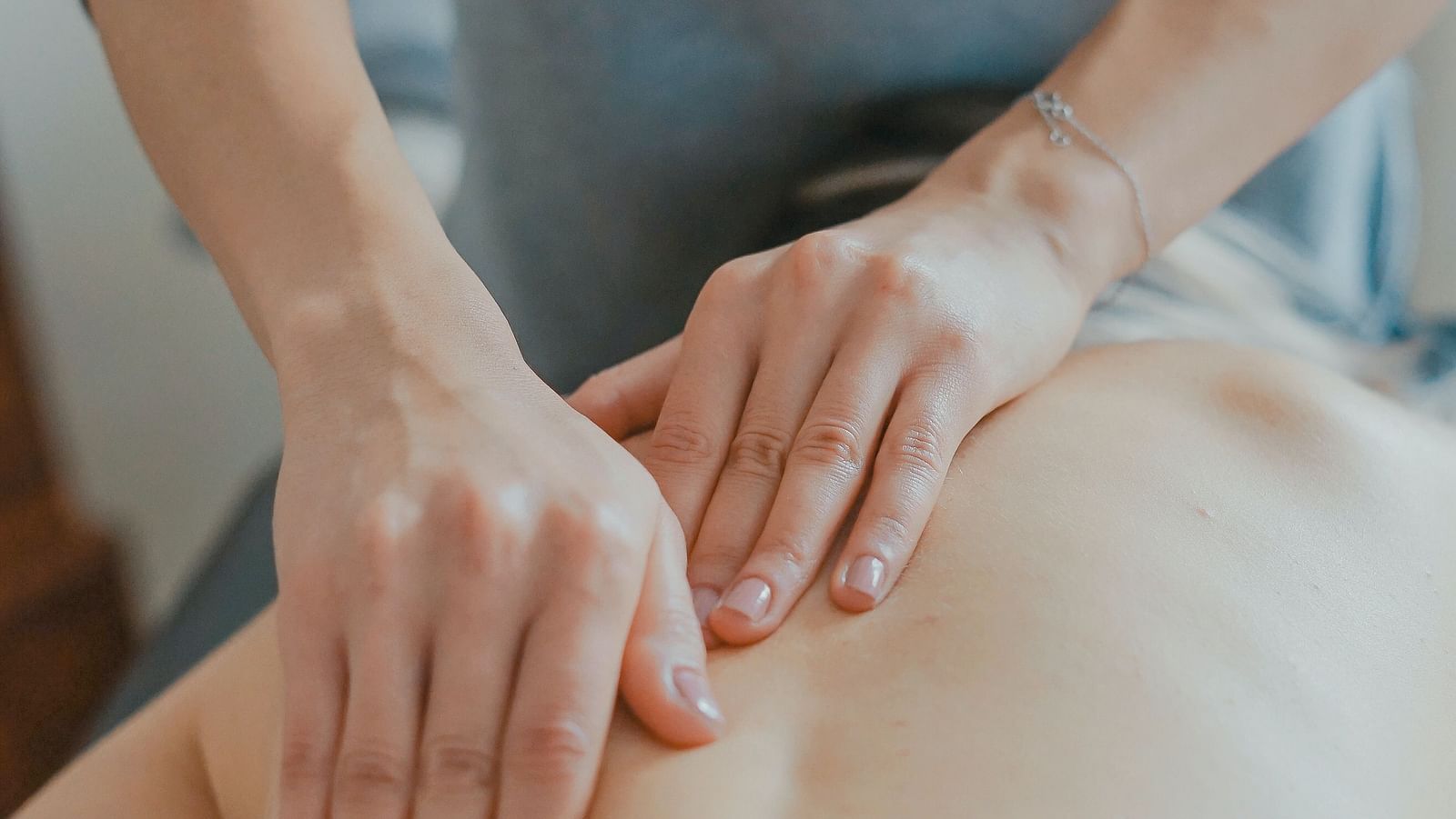 A woman getting a massage at a spa