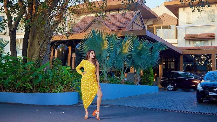 Woman in yellow polkadot dress and red heels - Rhythm Lonavala