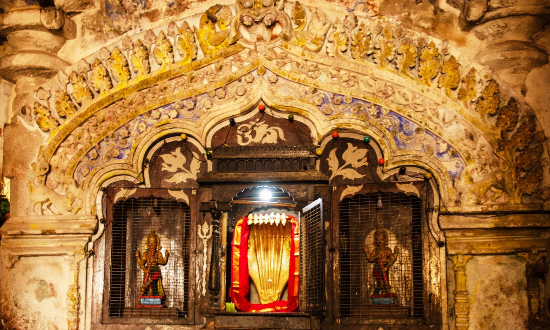 Virupaksha temple shrine with golden deity.